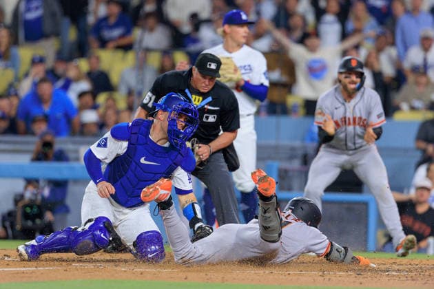 May 14, 2026, Los Angeles, California, USA: Will Smith 16 of the Los Angeles Dodgers is unable to catch the ball for an out at home and allowing Jung Hoo Lee 51 of the San Francisco Giants to score during a regular season MLB, Baseball Herren, USA game on Thursday May 14, 2026 at Dodger Stadium in Los Angeles, California. Dodgers defeat Giants, 5-2. JAVIER ROJAS PI Los Angeles USA - ZUMAp124 20260514_zaa_p124_015 Copyright: xJavierxRojasx