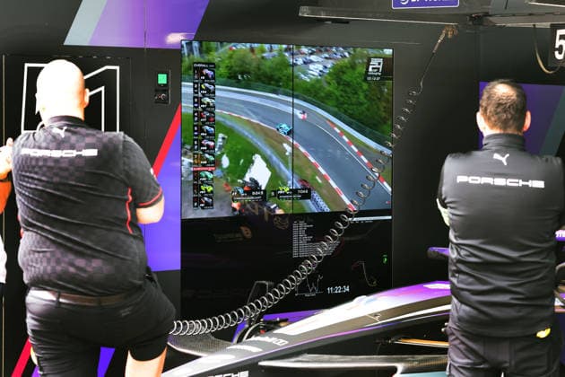Porsche team members watch the qualifying of the 24-hour race at the Nürburgring on the video screens in the Porsche pit, FIA Formula E World Championship Season 12, Monaco E Prix, MonteCarlo, MC, 15 05 2026,