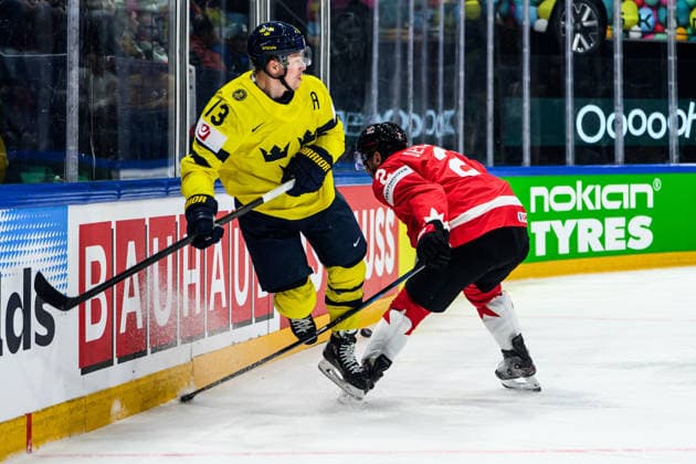 260515 Lucas Raymond of Sweden and Dylan Demelo of Canada during the 2026 IIHF Ice Hockey World Championship match between Canada and Sweden on May 15, 2026 in Fribourg Photo Jesper Zerman BILDBYRAN kod JZ JZ0714 ishockey ice hockey ishockey vm 2026 vm 2026 iihf world championship kanada canada sverige sweden bbeng  Copyright: JESPERxZERMAN BB260515BB165