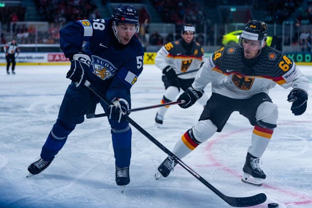 ZURICH, SWITZERLAND - MAY 15: Urho Vaakanainen (Finland, 58) in a duel against Marcus Weber (Germany, 64) during the Preliminary Round - Group A Match 1 between Finland and Germany at the IIHF Ice hockey, Eishockey World Championship, WM, Weltmeisterschaft 2026, Swiss Life Arena on May 15, 2026 in Zurich, Switzerland. Zurich Switzerland Copyright: xTimoxSteinx