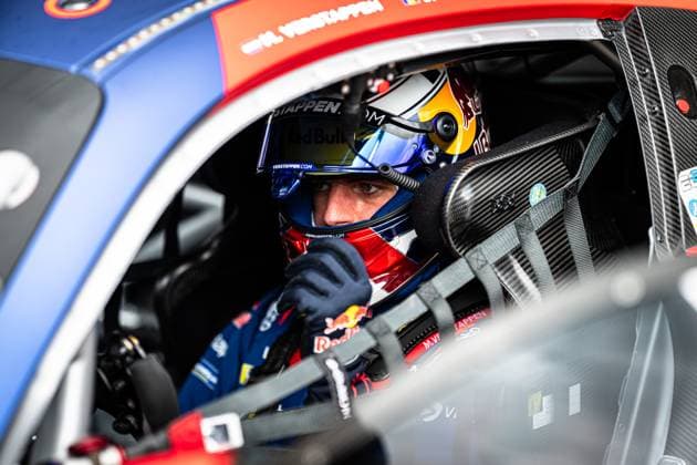Close-up from the cockpit of a GT3 racing car at the 24h Nürburgring Max Verstappen sits strapped into the drivers seat of the Mercedes AMG GT3 from Mercedes AMG Team Verstappen Racing The driver wears a characteristic helmet with Red Bull and Verstappen com branding The oversuit with the inscription M Verstappen and the blue and red color scheme of the vehicle can be seen in the background The shot conveys the concentrated atmosphere immediately before the race on the Nordschleife Max Verstappen in the cockpit at the 24h Nürburgring 2026 Copyright: xMichaelxGelhardtx