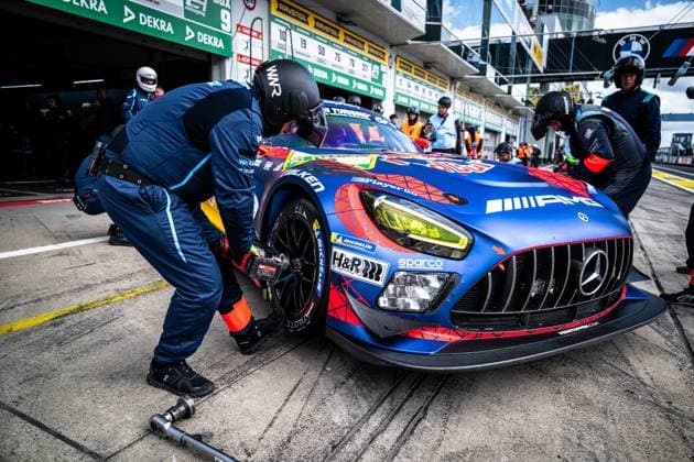 The Mercedes AMG GT3 with starting number 3 of the Mercedes AMG Team Verstappen Racing is serviced in the pit lane of the Nürburgring with a tire change A mechanic works with the wheel nut wrench on the front wheel, while other team members look after the vehicle The vehicle, wrapped in bright blue with a red network design, bears the sponsors AMG, H R, Sparco, Falken and Michelin, among others Daniel Juncadella Jules Gounon Lucas Auer Max Verstappen Mercedes AMG Team Verstappen Racing Mercedes AMG GT3 3 from Verstappen Racing at the pit stop at the Nürburgring Copyright: xMichaelxGelhardtx