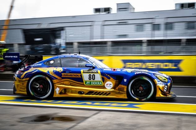 The Mercedes AMG GT3 with the starting number 80 of the Mercedes AMG Team RAVENOL passes the pit lane at the Nürburgring at full speed The vehicle presents itself in the characteristic blue and gold design with the RAVENOL sponsorship and the DEKRA logo Fabian Schiller Luca Stolz Maro Engel Maxime Martin Mercedes AMG Team RAVENOL Mercedes AMG GT3 80 by RAVENOL in the pit lane at the Nürburgring Copyright: xMichaelxGelhardtx
