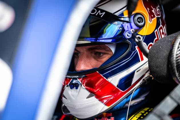 A close-up from the cockpit shows Max Verstappen in the Red Bull helmet with the characteristic design and the lettering MAXVERSTAP on the side and maxverstappen com on the chin area The driver of the Mercedes AMG Team Verstappen Racing looks out of the vehicle with concentration, framed by the blue bodywork of the racing car Max Verstappen in the cockpit at the 24h Nürburgring 2026 Copyright: xMichaelxGelhardtx