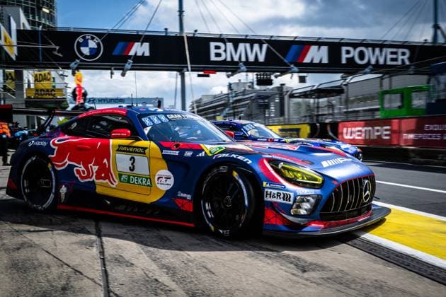 The Mercedes AMG GT3 with the starting number 3 of Mercedes AMG Team Verstappen Racing drives through the pit lane at the Nürburgring The car Daniel Juncadella Jules Gounon Lucas Auer Max Verstappen Mercedes AMG Team Verstappen Racing wears the characteristic Red Bull design in blue, red and yellow with sponsors such as RAVENOL, Falken, DEKRA and H R The striking BMW M Power banner can be seen in the background above the pit lane Mercedes AMG GT3 3 from Verstappen Racing in the pit lane Copyright: xMichaelxGelhardtx