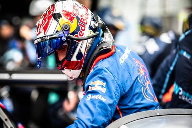 A driver with a striking Red Bull helmet and blue racing overalls with Red Bull and Viaplay sponsors gets into a vehicle at the Nürburgring Facial recognition indicates Max Verstappen Daniel Juncadella Jules Gounon Lucas Auer Max Verstappen with 46.2 confidence, but a clear identification is not possible due to the helmet and visor Other team members in blue overalls can be seen in the background Driver with Red Bull helmet getting into the vehicle at the Nürburgring Copyright: xMichaelxGelhardtx