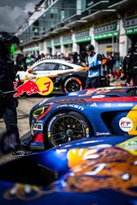 The Mercedes AMG GT3 with the starting number 3 of Mercedes AMG Team Verstappen Racing is parked in the pit lane of the Nürburgring The striking blue, red and yellow vehicle with Red Bull sponsorship and Falken tires is being looked after by mechanics Another GT3 vehicle with Hankook tires can be seen in the background The vehicle bears logos from RAVENOL, Michelin, H R and the Intercontinental GT Challenge emblem Daniel Juncadella Jules Gounon Lucas Auer Max Verstappen Mercedes AMG Team Verstappen Racing Mercedes AMG GT3 3 from Verstappen Racing in the pit lane Copyright: xMichaelxGelhardtx