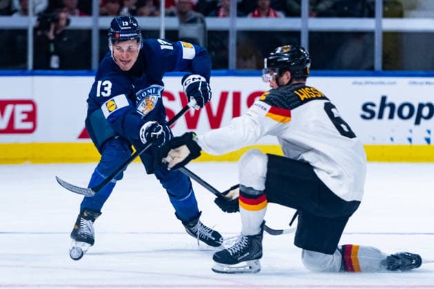 ZURICH, SWITZERLAND - MAY 15: Jesse Puljujaervi (Finland, 13) in the battle for the puck with Kai Wissmann (Germany, 6) during the Preliminary Round - Group A Match 1 between Finland and Germany at the IIHF Ice hockey, Eishockey World Championship, WM, Weltmeisterschaft 2026, Swiss Life Arena on May 15, 2026 in Zurich, Switzerland. Zurich Switzerland Copyright: xTimoxSteinx