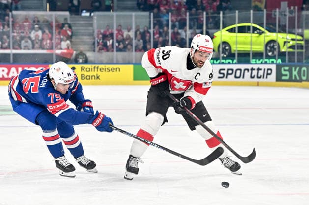 ZURICH, SWITZERLAND MAY 15 Roman Josi of Switzerland protects the puck from Connor Clifton of United States during the 2026 IIHF Ice Hockey World Championship Switzerland game between USA and Switzerland at Swiss Life Arena on May 15, 2026 in Zurich, Zurich Zurich Swiss Life Arena Zurich Switzerland Copyright: xJustPictures.ch AndreaxBrancax jp-en-EuSpIm-JP7_ANB_US_Sui_15052026_9317