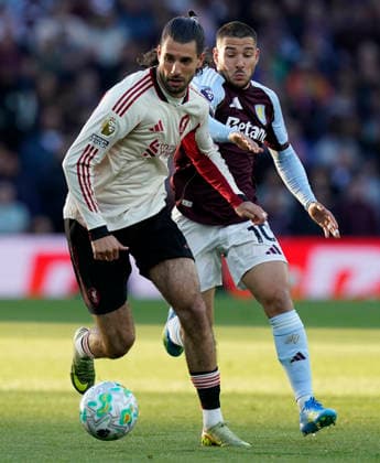 Birmingham, England, 15th May 2026. Dominik Szoboszlai of Liverpool (L) is challenged by Emiliano Buendia of Aston Villa during the Aston Villa vs Liverpool Premier League match at Villa Park, Birmingham. Picture credit should read: Andrew Yates Sportimage EDITORIAL USE ONLY. No use with unauthorised audio, video, data, fixture lists, club league logos or live services. Online in-match use limited to 120 images, no video emulation. No use in betting, games or single club league player publications. SPI_009_AY_ASTON_VILLA_LIVERPOOL SPI-4802-0009