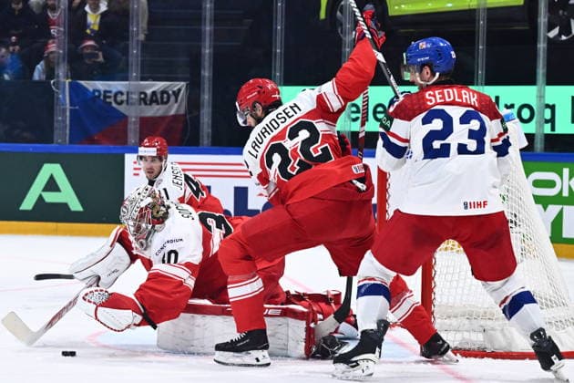 From left goalkeeper Mads Sogard of Denmark, Markus Lauridsen of Denmark and Lukas Sedlak of Czech Republic in action during the IIHF World Championship, WM, Weltmeisterschaft Group B match Czech Republic vs Denmark on May 15, 2026, Fribourg, Switzerland. (CTKxPhoto RadekxPetrasek) CTKPhotoP2026051508396  CTKPhotoP2026051508396