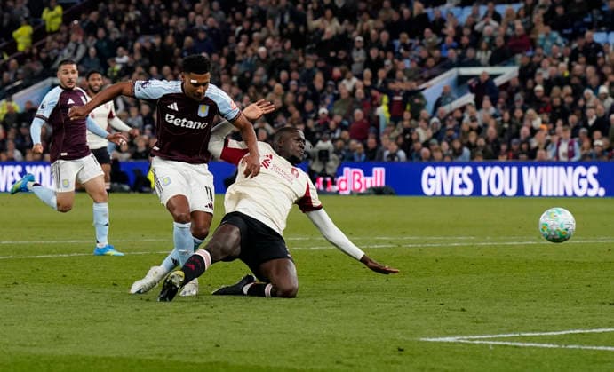 Birmingham, England, 15th May 2026. Ollie Watkins of Aston Villa (L) scores the second goal during the Aston Villa vs Liverpool Premier League match at Villa Park, Birmingham. Picture credit should read: Andrew Yates Sportimage EDITORIAL USE ONLY. No use with unauthorised audio, video, data, fixture lists, club league logos or live services. Online in-match use limited to 120 images, no video emulation. No use in betting, games or single club league player publications. SPI_023_AY_ASTON_VILLA_LIVERPOOL SPI-4802-0023