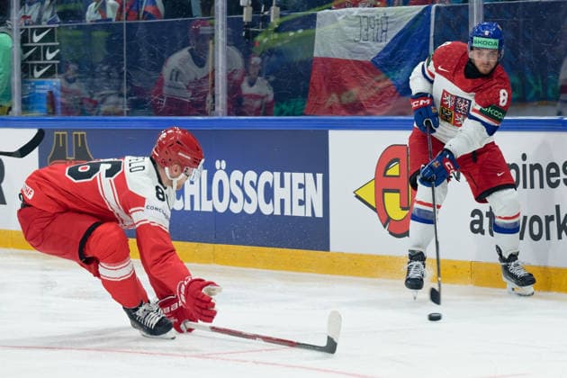 Fribourg, Switzerland - May 15 : Beranek Ondrej of Czechia shoots the puck (action) under pressure of Blichfeld Joachim of Denmark during the 2026 IIHF Ice hockey, Eishockey World Championship, WM, Weltmeisterschaft match between Czechia and Denmark at Fribourg BCF Arena on May 15 , 2026 in Fribourg, Switzerland. Copyright: xGiuseppexVelletrix Sportspressphoto_SPR147271