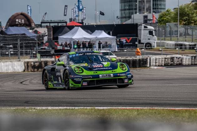 The Porsche 911 GT3 R with the starting number 48 from LOSCH Motorsport by BLACK FALCON drives through a bend on the Nürburgring The vehicle, painted in dark green with striking neon green accents Daan Arrow Dylan Pereira Patrick Assenheimer Tobias Müller 48 LOSCH Motorsport by BLACK FALCON bears the sponsors Liqui Moly, H R, Goodyear and Fanatec as well as the Gran Turismo logo on the front end The paddock infrastructure, tents and trucks can be seen in the background Porsche 911 GT3 48 from LOSCH Motorsport by BLACK FALCON at the Nürburgring Copyright: xMichaelxSchäferx