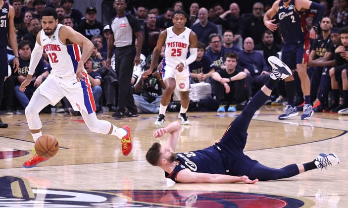 Detroit Pistons Tobias Harris (12) prepares to pick up a loose ball after Cleveland Cavaliers Dean Wade (32) slips and fall down in the fourth quarter in Cleveland, Ohio Friday May 15, 2026. The Pistons Defeated the Cavaliers 115-94.  CLE20260515114 AARONxJOSEFCZYK