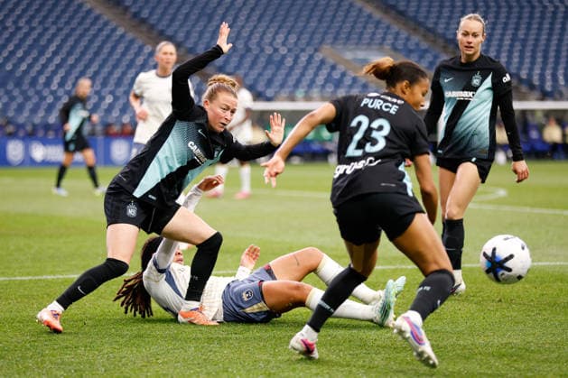 SEATTLE, WA - MAY 15: Forward Mia Fishel 19 of the Seattle Reign collides with defender Emily Sonnett 6 of Gotham FC during a game between Gotham FC and the Seattle Reign on May 15, 2026 at Lumen Field in Seattle, Washington. (Photo by Henry Rodenburg Icon Sportswire) SOCCER: MAY 15 NWSL Seattle Reign FC vs Gotham FC EDITORIAL USE ONLY Icon26051505