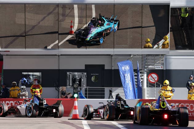Jean Eric vergne FRA Citroen, Dan Ticktum GBR Cupra Kiro drives out of the pit lane and is reflected in the ACM building, FIA Formula E World Championship Season 12, Monaco E Prix, MonteCarlo, MC, 16 05 2026, Automobile Club Monaco