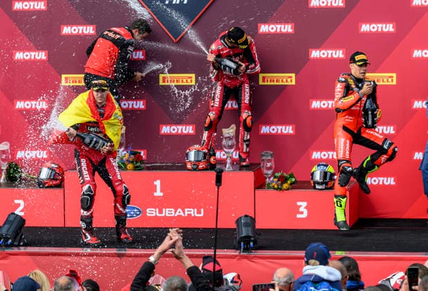 World Superbike Championship - WorldSBK Czech Round 2026, the first superbike race, at Autodrom Most, in Most, Czech Republic, on May 16, 2026. From left on the podium: Iker Lecuona from Spain (with flag) of the Aruba.It Racing - Ducati team, who finished second, winner Nicolo Bulega from Italy of the Aruba.It Racing - Ducati team and Yari Montella from Italy of the Barni Spark Racing Team, who finished third. (CTKxPhoto OndrejxHajek) CTKPhotoP2026051603684  CTKPhotoP2026051603684