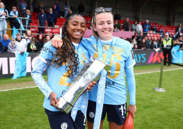 London, , 16th May 2026. Kerolin of Manchester City Women and Lauren Hemp of Manchester City Women celebrate with the WSL trophy after the West Ham United Women vs Manchester City Women Barclays Women s Super League match at Chigwell Construction Stadium, London. Picture credit should read: Paul Terry Sportimage EDITORIAL USE ONLY. No use with unauthorised audio, video, data, fixture lists, club league logos or live services. Online in-match use limited to 120 images, no video emulation. No use in betting, games or single club league player publications. SPI_051_PT_West_Ham_W_Man_City_W SPI-4804-0051