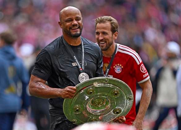 16 05 2026, Soccer Bundesliga 2025 2026, 34 Matchday, FC Bayern Munich 1 FC Cologne, in the Allianz Arena Munich, f l Coach Vincent Kompany FC Bayern Munich and Harry Kane FC Bayern Munich celebrate with championship trophy DFL and DFB regulations prohibit any use of photographs as image sequences and or quasi video
