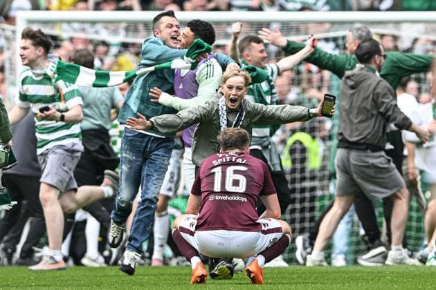Celtic v Heart of Midlothian William Hill Premiership Blair Spittal of Heart of Midlothian looks dejected as fan of Celtic celebrates on the pitch in front of him during the William Hill Premiership match at Celtic Park, Glasgow 16 05 2026 UK Newspapers OUT Copyright: xJamiexJohnstonx FIL-23440-0209