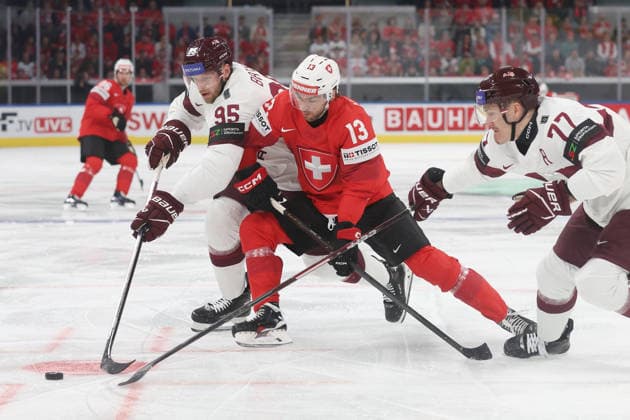 Ice Hockey World Championship 2026 SUI LAT Nico Hischier vs Oskars Batna and Kristaps Zile 16 05 2026 Swiss Life Arena Zuerich , SWITZERLAND, Men IIHF Ice Hockey World Championship Zurich 2026 Group Switzerland Latvia Nico Hischier center, Switzerland vs Oskars Batna left and Kristaps Zile Latvia