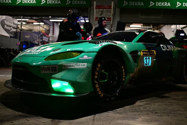 The Aston Martin Vantage GT3 Christian Konnerth Guido Dumarey Markus Lönnroth Maxime Dumarey Steven Palette Tobias Wahl PROsport Racing from PROsport Racing is at a night-time pit stop in the Nürburgring paddock The striking turquoise-colored car with green LED lighting at the front is being looked after by mechanics, The Walkenhorst Motorsport sign can be seen in the background Sponsors such as Goodyear Eagle, RAVENOL, Falken and H R are prominently displayed on the bodywork Aston Martin Vantage GT3 37 from PROsport Racing in the pit lane Copyright: xMichaelxGelhardtx