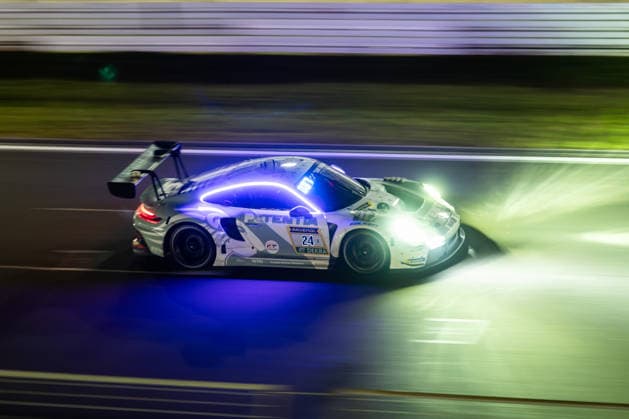 The Porsche 911 GT3 R 992 Evo26 with starting number 24 from the Lionspeed GP team with drivers Laurin Heinrich, Laurens Vanthoor and Ricardo Feller drives at night on the Nürburgring Grand Prix circuit in Nürburg, Rhineland-Palatinate, Germany during the 24-hour race