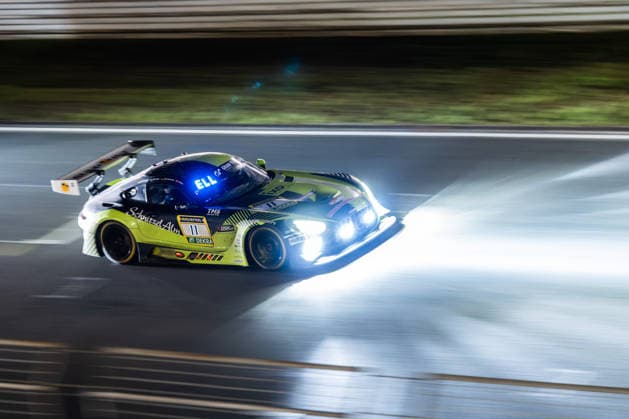 The Mercedes AMG GT3 with starting number 11 from the SR Motorsport by Schnitzelalm team with drivers Kenneth Heyer, Jannes Fittje, Jay Mo Härtling and Philip Ellis will drive at night on the Nürburgring Grand Prix circuit in Rhineland-Palatinate Germany during the 24-hour race.