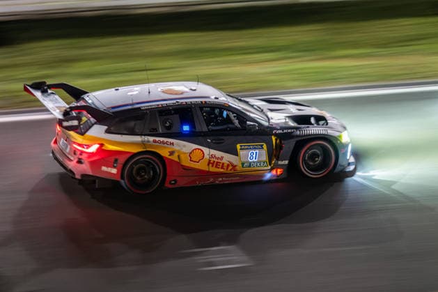 The BMW M3 Touring 24h with starting number 81 from the BMW M Motorsport team with drivers Jens Klingmann, Ugo de Wilde, Connor de Phillippi and Neil Verhagen drives at night during the 24h race on the Nürburgring Grand Prix circuit in Nürburg Rhineland-Palatinate Germany