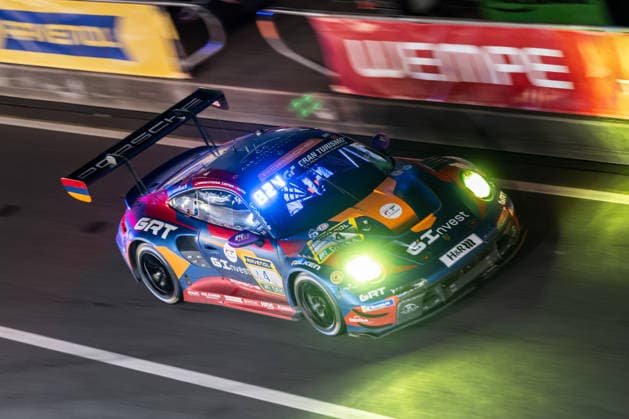 drives during the 24h race at night in the pit lane on the Grand Prix circuit of the Nürburgring Nürburg Rhineland-Palatinate Germany