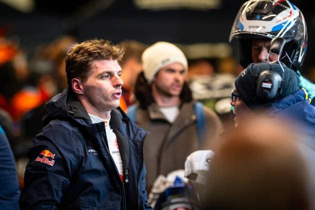 Max Verstappen from Mercedes AMG Team Verstappen Racing stands in the paddock of the Nürburgring and talks to team members He wears a dark team jacket with Red Bull and Verstappen Racing logo In the background you can see a driver with a Schuberth helmet Max Verstappen in the paddock at the 24h Nürburgring 2026 Copyright: xMichaelxGelhardtx