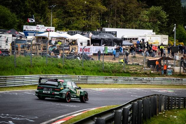The Adam Adelson James Green Lance David Arnold Renger Van der Zande HWA Engineering Speed from HWA Engineering Speed drives through a corner on the Nordschleife at the Nürburgring The dark green car bears the starting number 63 and is labeled with the sponsors PARKSIDE, H R, RONAL and CTIEK In the background, numerous spectators watch the race from the embankment, while advertising banners from ROWE Motor Oil and Grünbeck can be seen Green racing car 63 from HWA Engineering Speed on the Nordschleife Copyright: xMichaelxGelhardtx