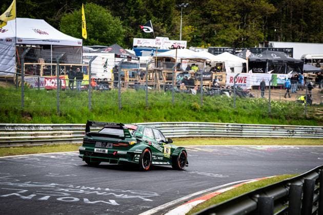 The dark green car from HWA Engineering Speed with starting number 63 negotiates a bend on the Nordschleife of the Nürburgring The car bears eye-catching sponsors such as PARKSIDE, H R and Hankook on the bodywork Spectators, tents and advertising banners of the sponsors ROWE Motor Oil and KW Suspensions can be seen in the background Adam Adelson James Green Lance David Arnold Renger Van der Zande HWA Engineering Speed HWA Engineering Speed 63 on the Nordschleife at the Nürburgring Copyright: xMichaelxGelhardtx