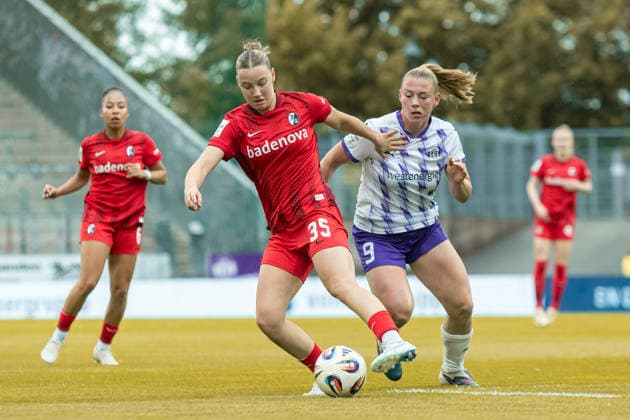 Zoe Schick Sport Club Freiburg and Ramona Maier SGS Essen battle for the ball during the Women s Soccer Bundesliga match between SGS Essen and Sport Club Freiburg, Stadion an der Hafenstrasse on May 17, 2026 in Essen, Germany, Germany Photo by Mario Hommes DeFodi Images Zoe Schick Sport Club Freiburg and Ramona Maier SGS Essen battle for the ball during the Women s Soccer Bundesliga match between SGS Essen and Sport Club Freiburg at Stadion an der Hafenstrasse on May 17, 2026 in Essen, Germany Photo by Mario Hommes DeFodi Images DFL regulations prohibit any use of photographs as image sequences and or quasi video