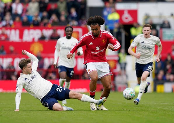 Manchester, England, 17th May 2026. Luca Netz of Nottingham Forest tackles Joshua Zirkzee of Manchester United, ManU during the Manchester United vs Nottingham Forest Premier League match at Old Trafford, Manchester. Picture credit should read: Andrew Yates Sportimage EDITORIAL USE ONLY. No use with unauthorised audio, video, data, fixture lists, club league logos or live services. Online in-match use limited to 120 images, no video emulation. No use in betting, games or single club league player publications. SPI_116_AY_Man_Utd_Forest SPI-4806-0106
