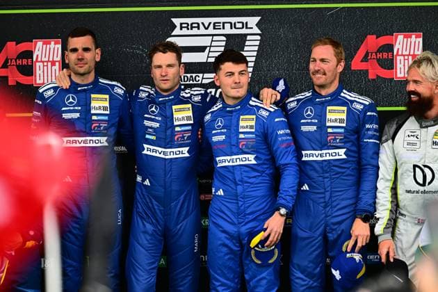 The Mercedes AMG Team RAVENOL presents its driver crew for the 24-hour race at the Nürburgring The drivers Luca Stolz, Maro Engel, Maxime Martin and Fabian Schiller stand in their blue RAVENOL racing overalls with Mercedes and RAVENOL sponsorship in front of the backdrop of the event backdrop in the paddock Mercedes AMG Team RAVENOL drivers at the 24h Nürburgring 2026 Copyright: xMichaelxGelhardtx