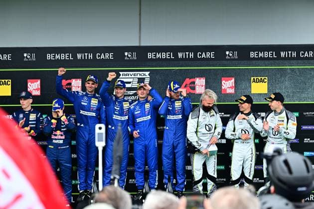 Award ceremony on the podium of the 24h Nürburgring with the drivers of Mercedes AMG Team RAVENOL 80 in blue racing overalls and the Walkenhorst Motorsport 34 team in white overalls The winners celebrate their success in the endurance race with champagne and trophies Mercedes AMG Team RAVENOL and Walkenhorst Motorsport on the podium Copyright: xMichaelxGelhardtx