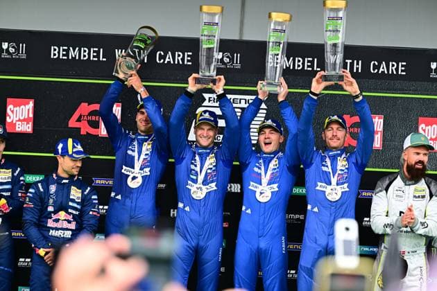 The Mercedes AMG Team RAVENOL with starting number 80 presents itself on the podium of the 24h Nürburgring with trophies and medals The drivers in blue overalls hold up their trophies and celebrate a successful endurance race on the legendary Nordschleife Mercedes AMG Team RAVENOL 80 celebrates podium success at the Nürburgring Copyright: xMichaelxGelhardtx