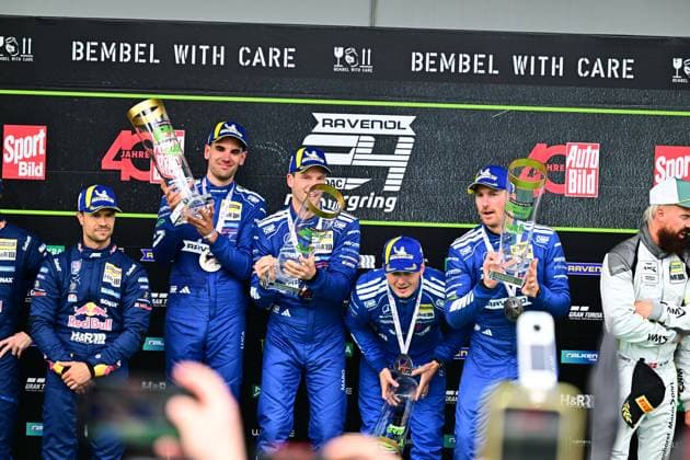 The winning team Mercedes AMG Team RAVENOL with starting number 80 presents itself on the podium of the 24h Nürburgring Luca Stolz, Maro Engel and Maxime Martin hold the trophy and celebrate the endurance success on the Nordschleife Mercedes AMG Team RAVENOL 80 celebrates victory at the 24h Nürburgring 2026 Copyright: xMichaelxGelhardtx