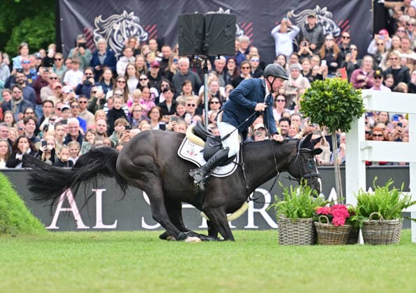 GER Al Shira aa German Jumping Dressage Derby Hamburg, Al Shira aa 95 German Jumping Derby 17 05 2026, GER Al Shira aa German Jumping Dressage Derby Hamburg, PAl Shira aa 95 German Jumping Derby presented by Melitta CSI4 Al Shira aa Derby Tour Final in picture Michael Grimm GER on Duplexx almost stumbles after the wall nordphotoxGmbH xWitke nph00002
