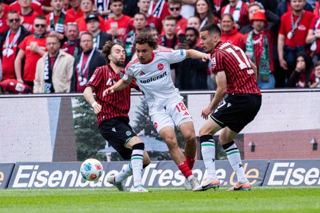 Hannover, Germany 17 May 2026 2 BL 2025 2026 Sp 34 Hannover 96 v 1 FC Nürnberg Pictured from left in duel Kolja Nuno Oudenne HAN , Rafael Lubach FCN and Bastian Allgeier HAN DFL DFB regulations prohibit any use of photographs as image sequences and or quasi video Heinz von Heiden Arena Niedersachsen Copyright: xFotostandx xKruczynskix
