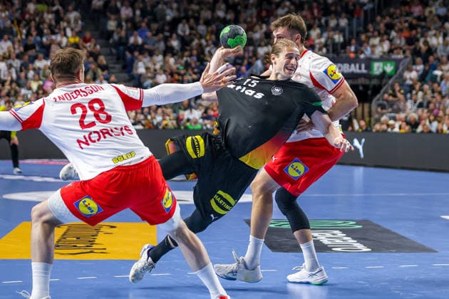 17 05 2026, xkwix, handball, international match, Germany Denmark , Lanxess Arena in Cologne Juri Knorr Germany 15 throwing and tackling Niclas Vest Kirkelokke Denmark 3 and Lasse Andersson Denmark 28 Photo xKamilxWilkowskixPressefotoKochx Nordrhein Westfalen Germany