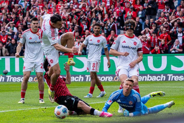 Hannover, Germany 17 May 2026 2 BL 2025 2026 Sp 34 Hannover 96 v 1 FC Nürnberg Pictured from left in a duel Berkay Yilmaz FCN , Daisuke Yokota HAN and goalkeeper Jan Reichert FCN DFL DFB regulations prohibit any use of photographs as image sequences and or quasi video Heinz von Heiden Arena Niedersachsen Copyright: xFotostandx xKruczynskix