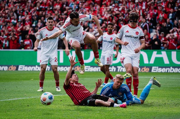 2 Bundesliga Hannover 96 vs 1 FC Nürnberg, 17 05 2026 Berkay Yilmaz 1 FC Nürnberg, 21 jumps over Daisuke Yokota Hannover 96, 18 and Jan Reichert 1 FC Nürnberg, 1 lies on the ground Football, 2 Bundesliga, Matchday 34 Hannover 96 vs 1 FC Nürnberg on 17 05 2026 at Heinz von Heiden Arena, Hannover DFL REGULATIONS PROHIBIT ANY USE OF PHOTOGRAPHS AS IMAGE SEQUENCES AND OR QUASI VIDEO Copyright: xBEAUTIFULxSPORTS Tonhäuserx