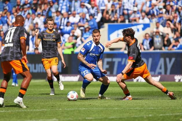 Magdeburg, Saxony-Anhalt, Germany, 17 05 2026 Avnet Arena 34 Matchday, Season 2025 26, 2 Soccer Bundesliga 1 FC Magdeburg 1 FC Kaiserslautern L R kai41, Fabian Kunze 6, 1 FC Kaiserslautern , Mateusz Zukowski 22, 1 FC Magdeburg and Leon Robinson 37, 1 FC Kaiserslautern Copyright: xdtsxNachrichtenagenturx dts_119129