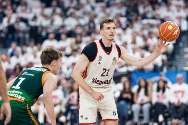 MUNICH, GERMANY - MAY 17: Justus Hollatz (FC Bayern Muenchen, 21) controls the ball against Steven Ashworth (Vet-Concept Gladiators Trier, 1) during the easyCredit Basketball Bundesliga Playoffs Quarterfinal Game 1 between FC Bayern Muenchen vs. Vet-Concept Gladiators Trier at SAP Garden on match 1 of the Playoffs Quarterfinals Best of Five of easyCredit Basketball Bundesliga on May 17, 2026 in Munich, Germany. Bavaria Germany Copyright: xSteffiexWunderlx