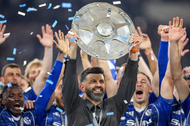 17 05 2026, Football, FC Schalke 04 Eintracht Braunschweig, 34 Matchday, 2 Bundesliga, Veltins Arena Gelsenkirchen, Season 2025 2026 Schalke 04 is champion of the 2 Bundesliga The team wins the championship and stands cheering on the pitch Joy and emotions after the victory Head coach Miron Muslic Schalke04 center with the championship trophy at the award ceremony DFB regulations prohibit any use of photographs as image sequences and or quasi video North Rhine-Westphalia Germany