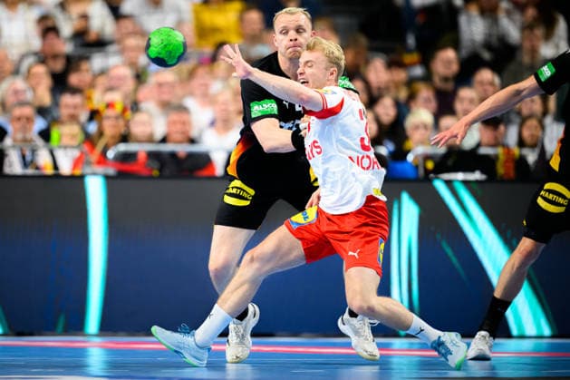 Koeln Handball Laenderspiel Deutschland Daenemark v li in the duel Justus Fischer Germany and Daenemarks Hjalte Lykke Koeln Lanxess Arena Germany
