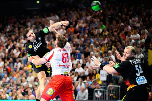 Cologne Handball Laenderspiel Germany Denmark Renars Uscins Germany , Denmarks Steven Jacobsen, Justus Fischer Germany Cologne Lanxess Arena Germany